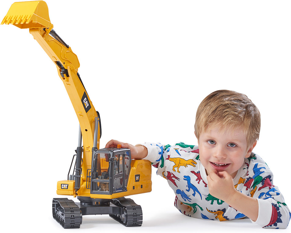 Image of child playing with Caterpillar Excavator